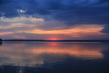 Fototapeta na wymiar sunset over the lake in summer
