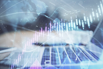 Stock market graph and table with computer background. Multi exposure. Concept of financial analysis.