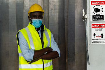 Caution sign in factory warning to industry labor worker to prevent Covid-19 Coronavirus spreading...