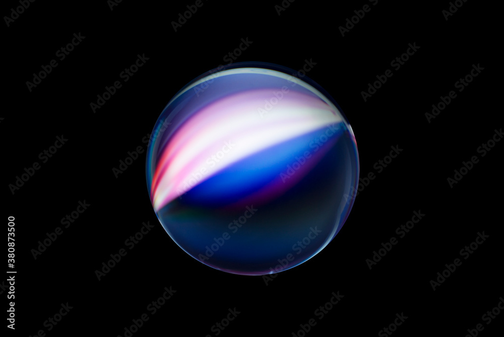 Wall mural blurry image of a shiny crystal ball with abstract blurry colorful pattern. abstract lensball in blu
