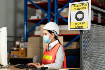 Caution sign in factory warning to industry labor worker to prevent Covid-19 Coronavirus spreading...