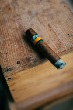 Close-up of half smoked cuban cigar