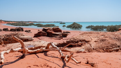 Red sand beach and turquoise water