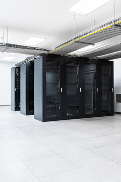 Servers in aisle of storage cabinets in data center