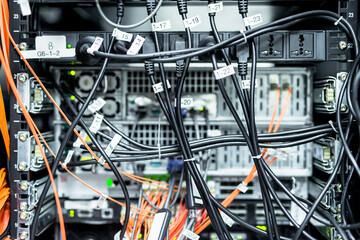 Complex array of wires at back of server cabinet