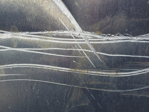 Scratch marks on metal wall