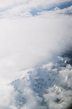 The snow-capped top of the mountain from illuminator of the plane