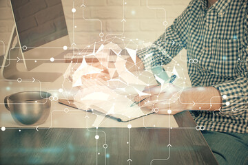 Fototapeta premium Man typing on keyboard background with brain hologram. Concept of big Data. Double exposure.