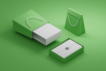 Obraz premium Composition with shopping paper bags and boxes on green backgrond with blank surfaces