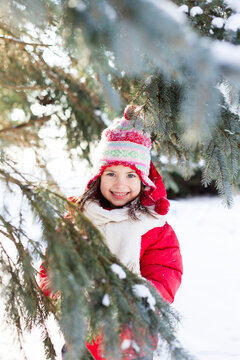 Beautiful young girl wearing red coat smiling at camera