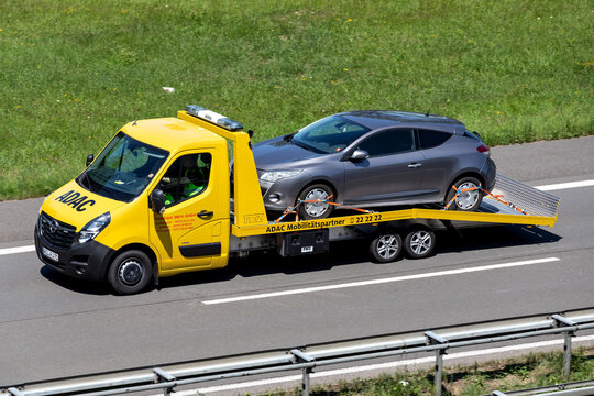 ENGELSKIRCHEN, GERMANY - JUNE 24, 2020: ADAC flatbed recovery vehicle on motorway. German ADAC it is the largest automobile club in Europe.