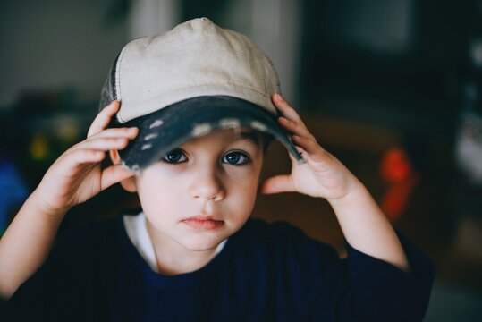 Boy is plaing with the cap