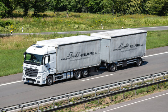 ENGELSKIRCHEN, GERMANY - JUNE 24, 2020: Brohl Wellpappe Mercedes-Benz Actros combination truck with curtainside trailer on motorway.