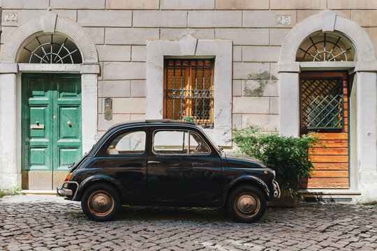 Small Retro Car Parked on the Street In Rome, Italy