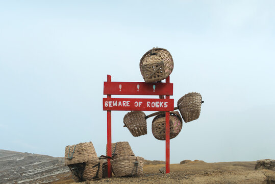 Miners carry baskets of sulphur of Ijen crater