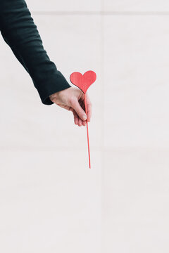 Woman hand holding a heart