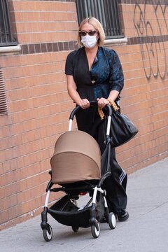 Chloe Sevigny, pushing baby carriage, wearing mask out and about for Celebrity Candids - FRI