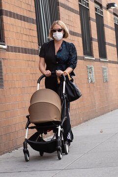 Chloe Sevigny, pushing baby carriage, wearing mask out and about for Celebrity Candids - FRI