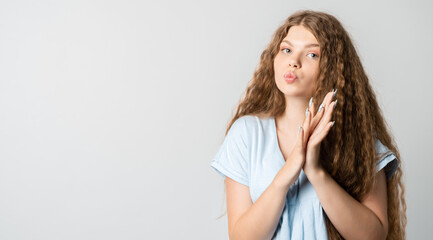 Positive Young blonde woman laughing. Studio shot white background. Human emotions facial expression concept. Copy space