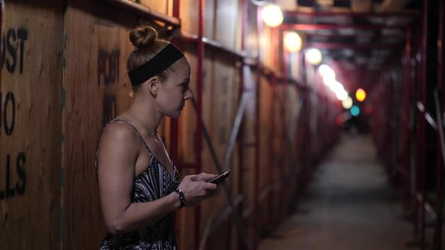 Scared Woman using Smartphone at Night