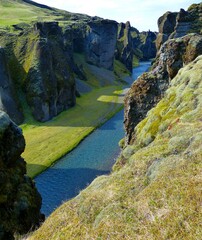 Beautiful Fjadrargljufur Canyon, Iceland. Fjadra River. Wonderful icelandic landscape. Green mossy cliffs.