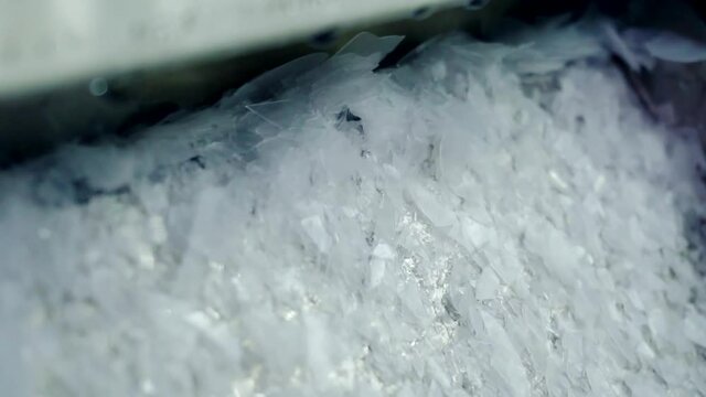 ice crystals produced by a ice making machine are into a tray