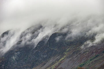 Beautiful dramatic Lake District landscape image of thick low cloud hanging over Illgill Head in wasdale Valley giving a very effective image