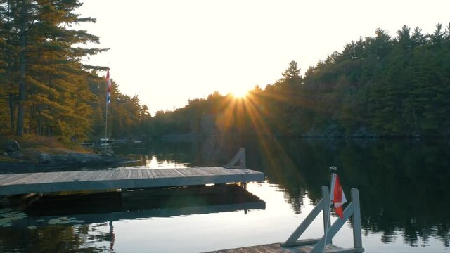Beautiful sunset by docks and a calm lake