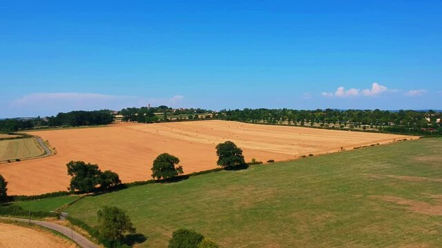 sidewards moving drone shot of fields in France near small village Taize.