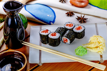 Sushi rolls hosomaki with salmon are on the plate