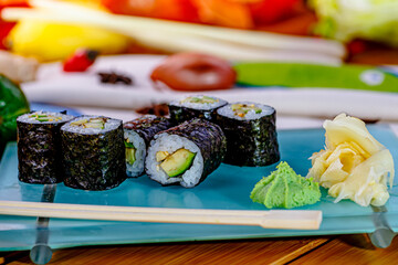 Sushi rolls hosomaki with avocado are on the plate