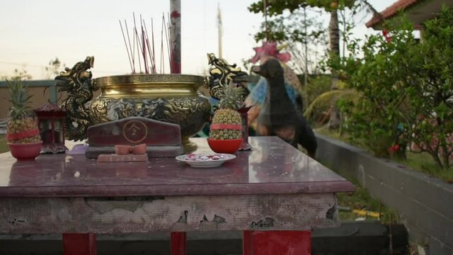 buddhist incense altar table at vihara satya dharma benoa denpasar bali indonesia