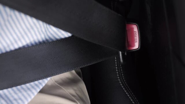 Fastening the seatbelt in a car, safety first