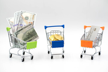 Dollars,Bitcoin and Credit Card in Shopping Cart On White Background.