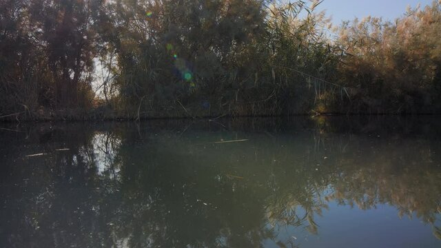 water surface in Azraq Wetland Reserve, Jordan. low angle wide view pan right. 4K