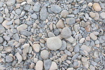 Gray sea pebbles background. Top view.