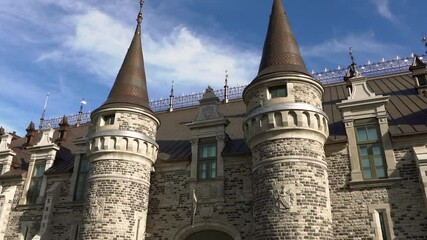 Panning shot of the rebuilt Quebec City Armoury on a sunny day
