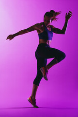 Fototapeta na wymiar Monochrome portrait of a fit woman exercising