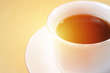 Close up image of coffee cup with sun light in the morning with copy space for text, time of coffee break