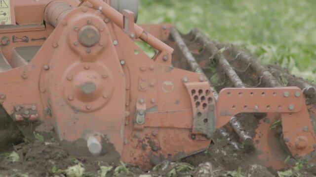Field beng plowed by tractor. Filmed in 4K at 240fps