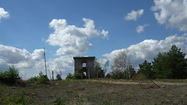 Ruins of concrete building at former military training area Jueterbog in late summer
