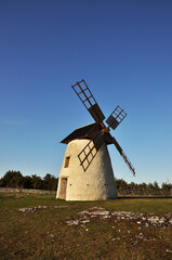 Fototapeta na wymiar Old windmill in sweden against blue sky.