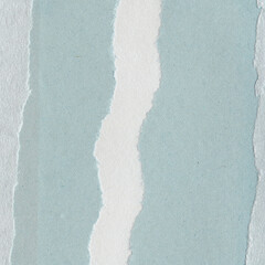 Colorful torn paper collage close-up. Texture made from various paper and cardboard parts. Damaged old paper background. Vintage blank wallpaper. Material design backdrop.