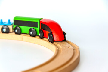 Fototapeta premium Children's railway made of wood on a white background.