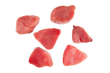 Yellow fin tuna steaks isolated on black background. Fresh rare tuna steaks isolated on black. Raw yellowfin tuna fillet texture. Background fresh tuna meat. Top view of slices of tuna meat.