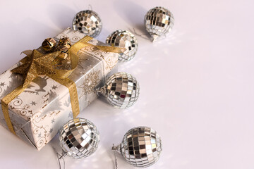new year gift and christmas balls on white background