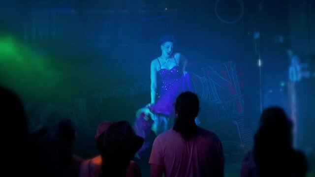Beautiful dancer shows her legs on stage like cabaret burlesque can-can dancing