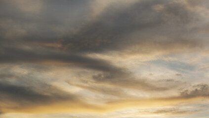 Fototapeta na wymiar Beautiful sunset sky above clouds with dramatic light