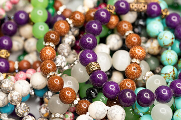 Different colorful beads. Macro shot. Selective focus.