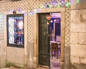 entrance covered with the traditional ceramic tiles called azulejos, with Christmas lights.Lisbon,Portugal